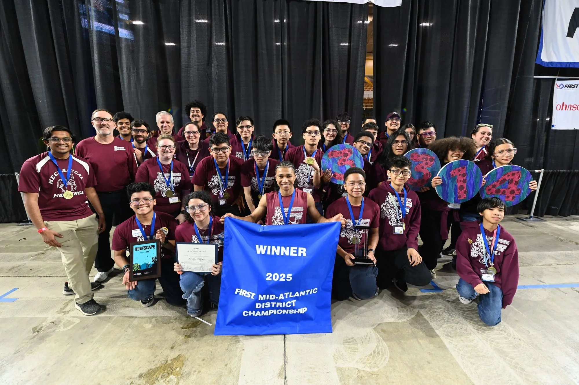 Team 3314 with the 2025 FIRST Mid-Atlantic District Championship winner banner