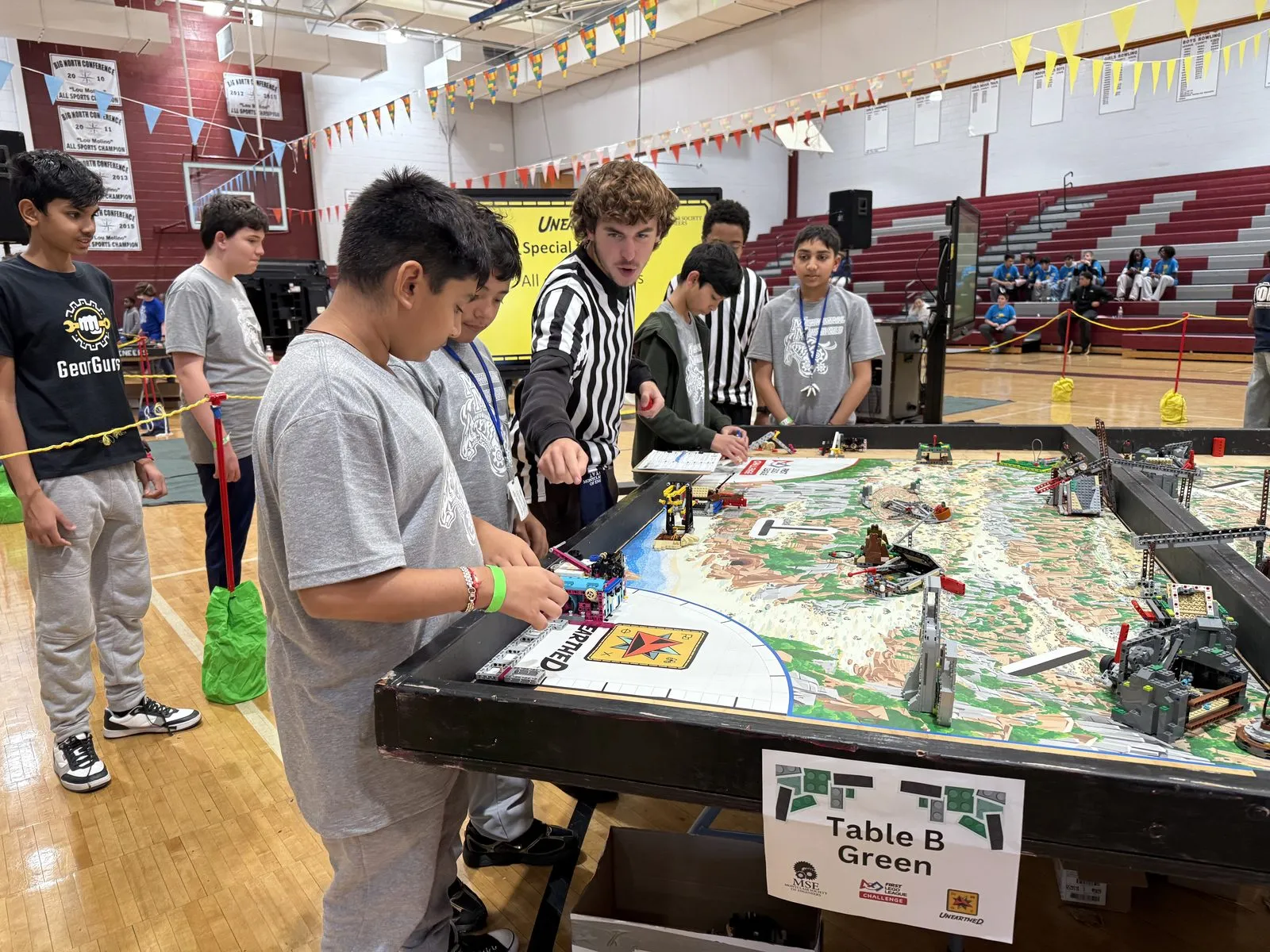Middle schoolers at an FLL Challenge table at our qualifier