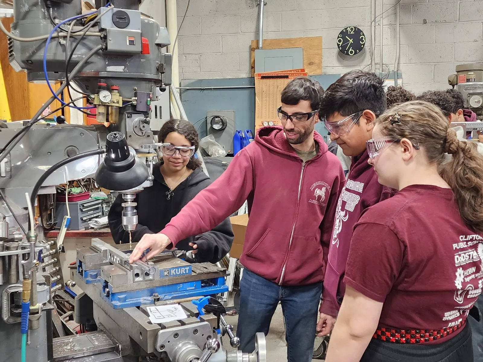Students working in the Team 3314 shop